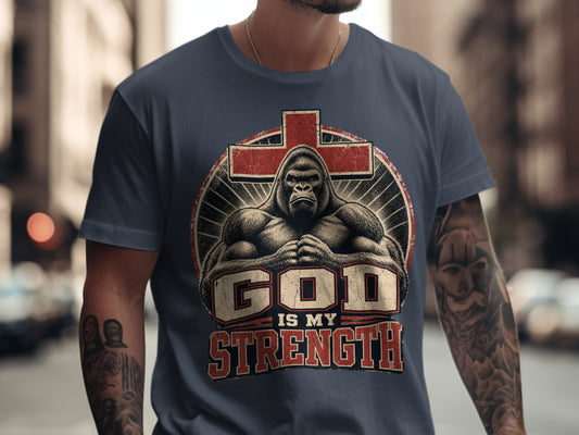 Gorilla and cross graphic on a dark blue t-shirt with text "GOD IS MY STRENGTH".