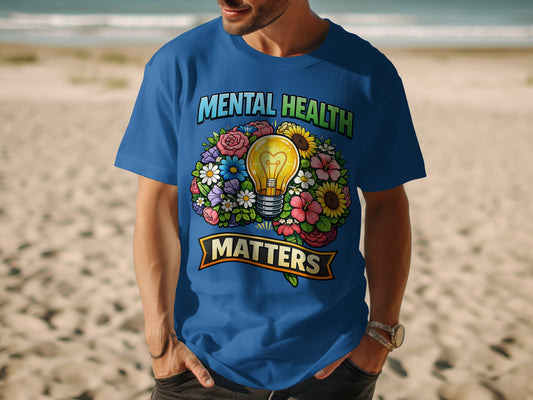Blue t-shirt with 'Mental Health Matters' and a lightbulb surrounded by flowers.