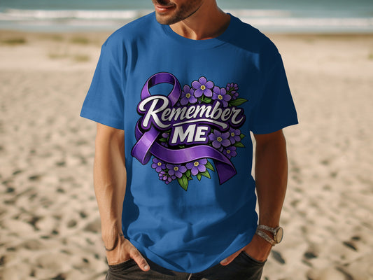 Blue t-shirt with purple ribbon and flowers graphic that reads "Remember ME."