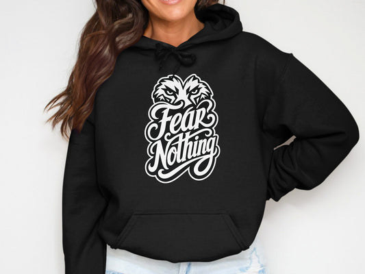 Black hoodie with white graphic text "Fear Nothing" and wolf's head.