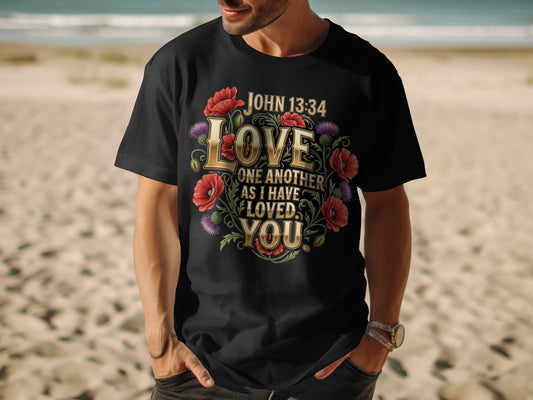 Black t-shirt with floral design and John 13:34 text: Love one another as I have loved you.