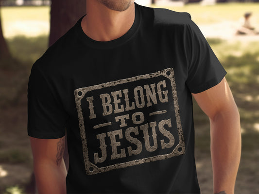 Black t-shirt with distressed text "I BELONG TO JESUS" in a rectangular frame.