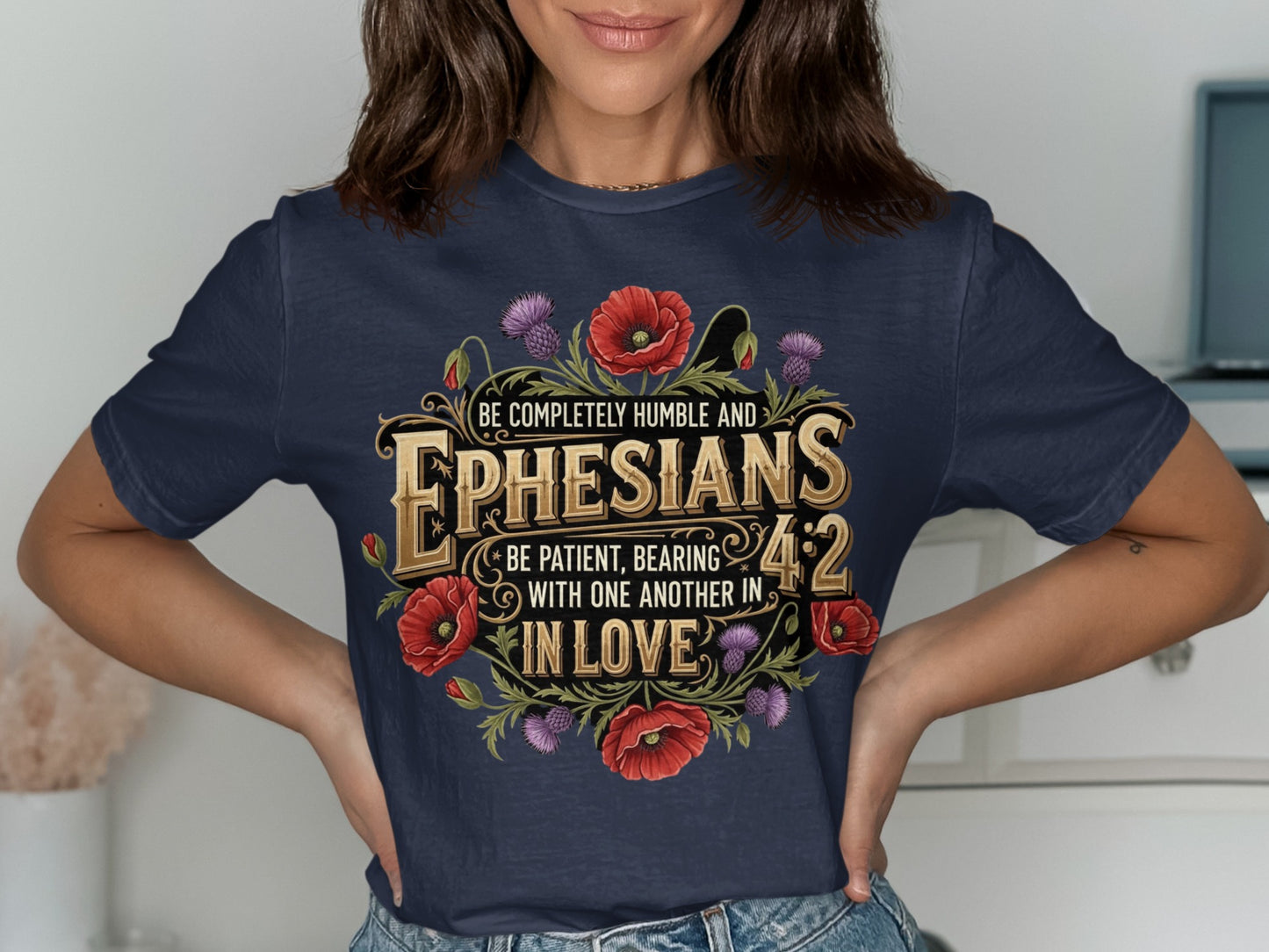 Navy t-shirt with Ephesians 4:2 text and floral design.
