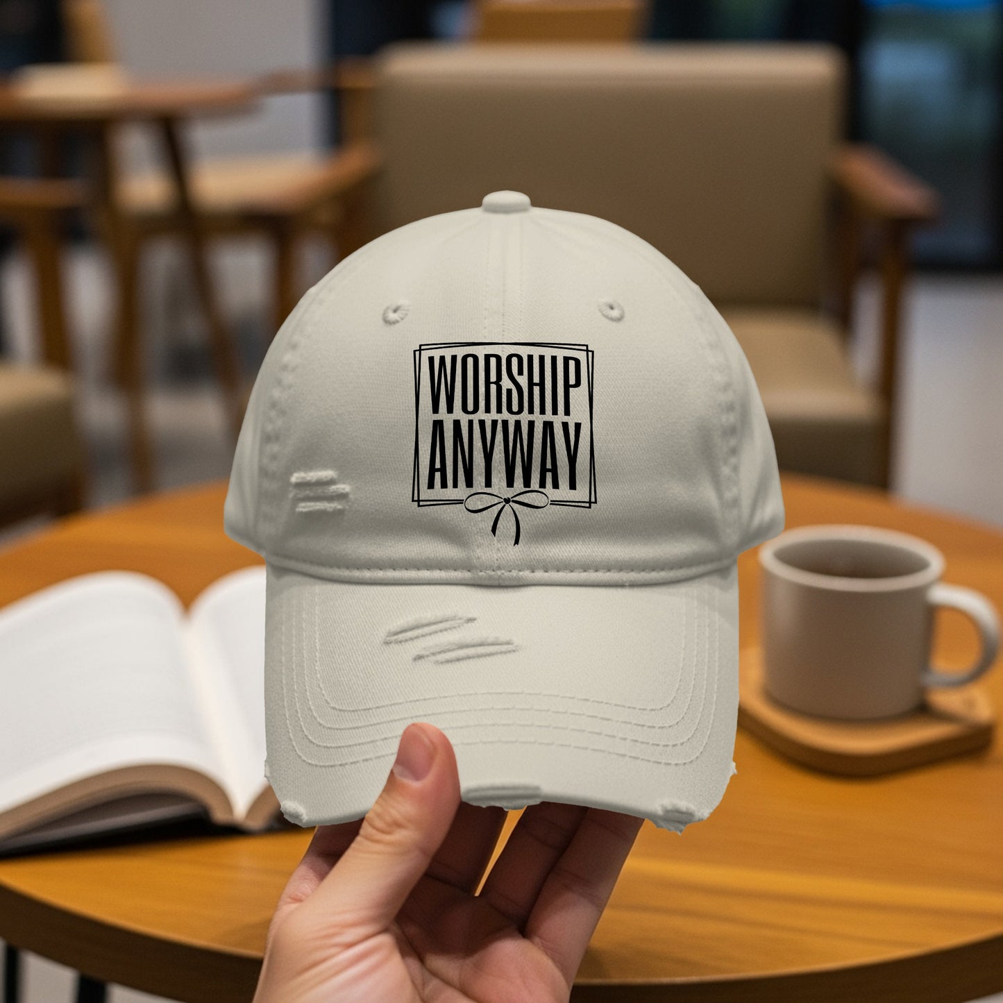Lightweight distressed baseball cap with "Worship Anyway" text and bow.