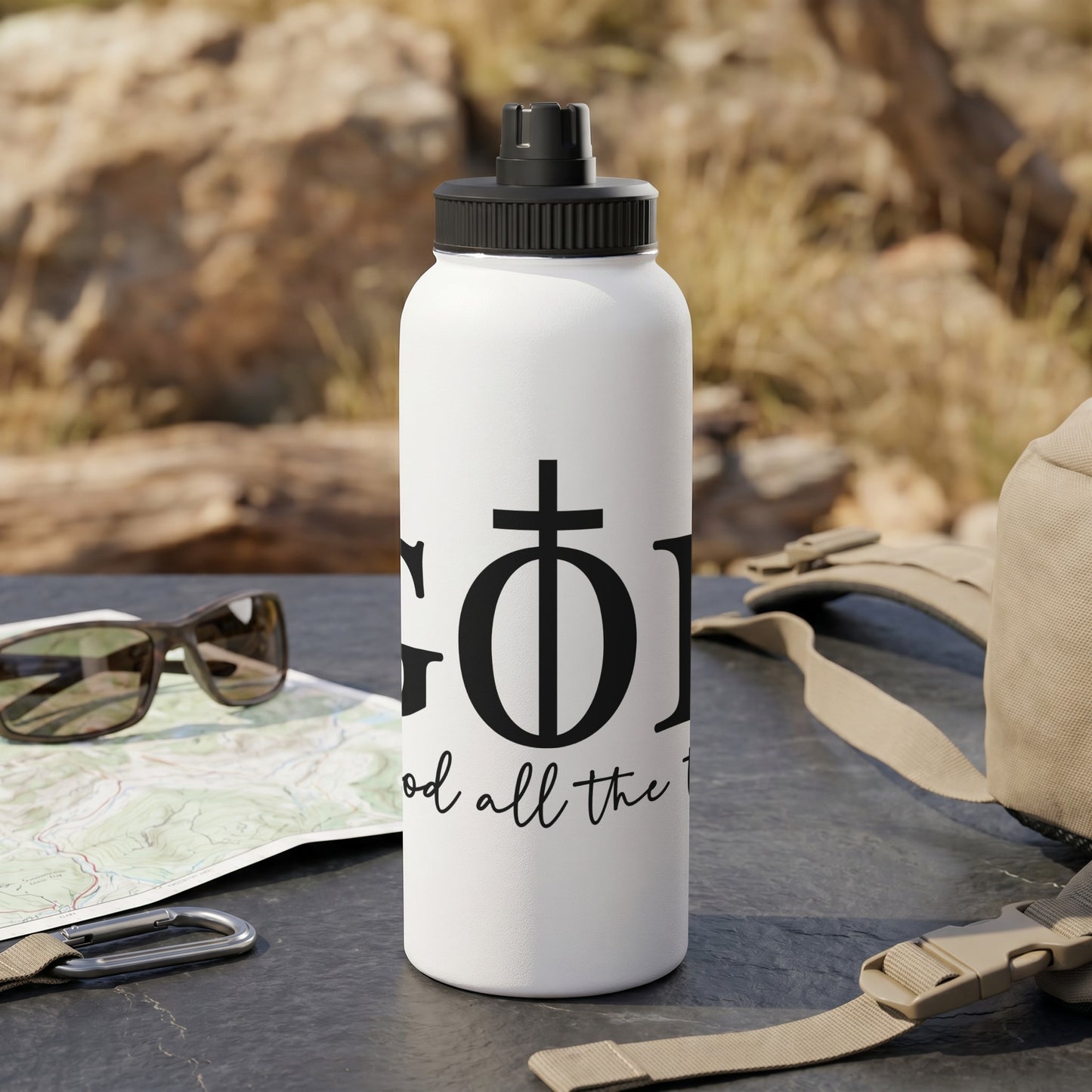 White water bottle with black text "GOD" and "God all the time".