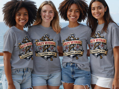 Four smiling women wear grey t-shirts with anchor and ribbon graphic and text.