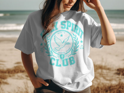White t-shirt with "Holy Spirit Club" graphic featuring a dove and laurel leaves.