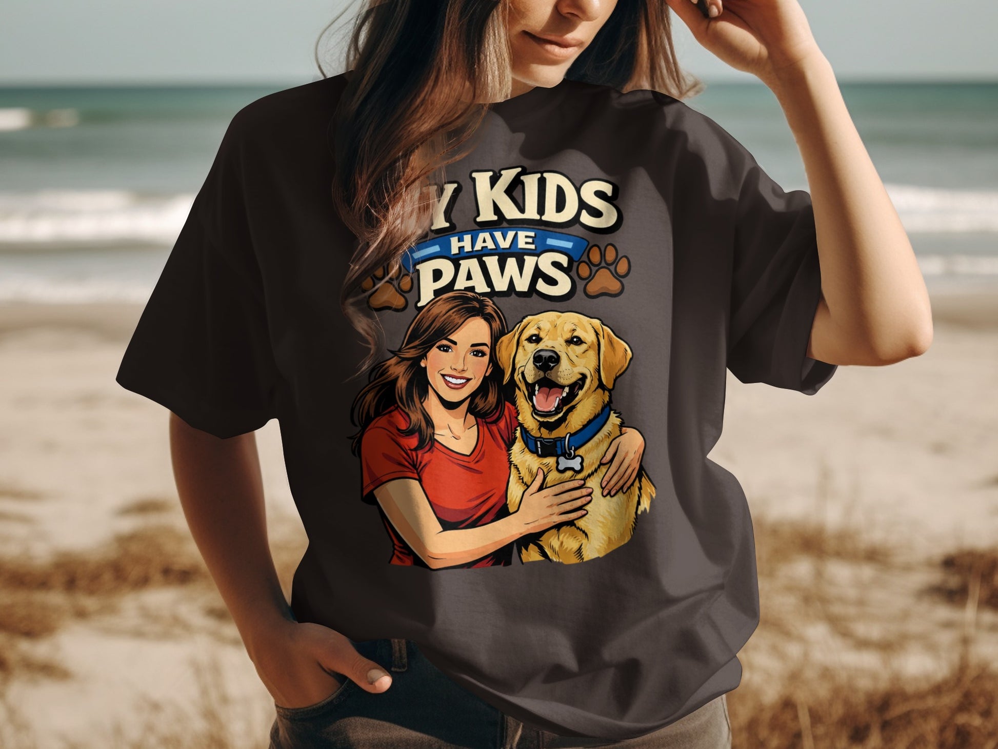 Woman and golden retriever with text "MY KIDS HAVE PAWS" on a t-shirt.