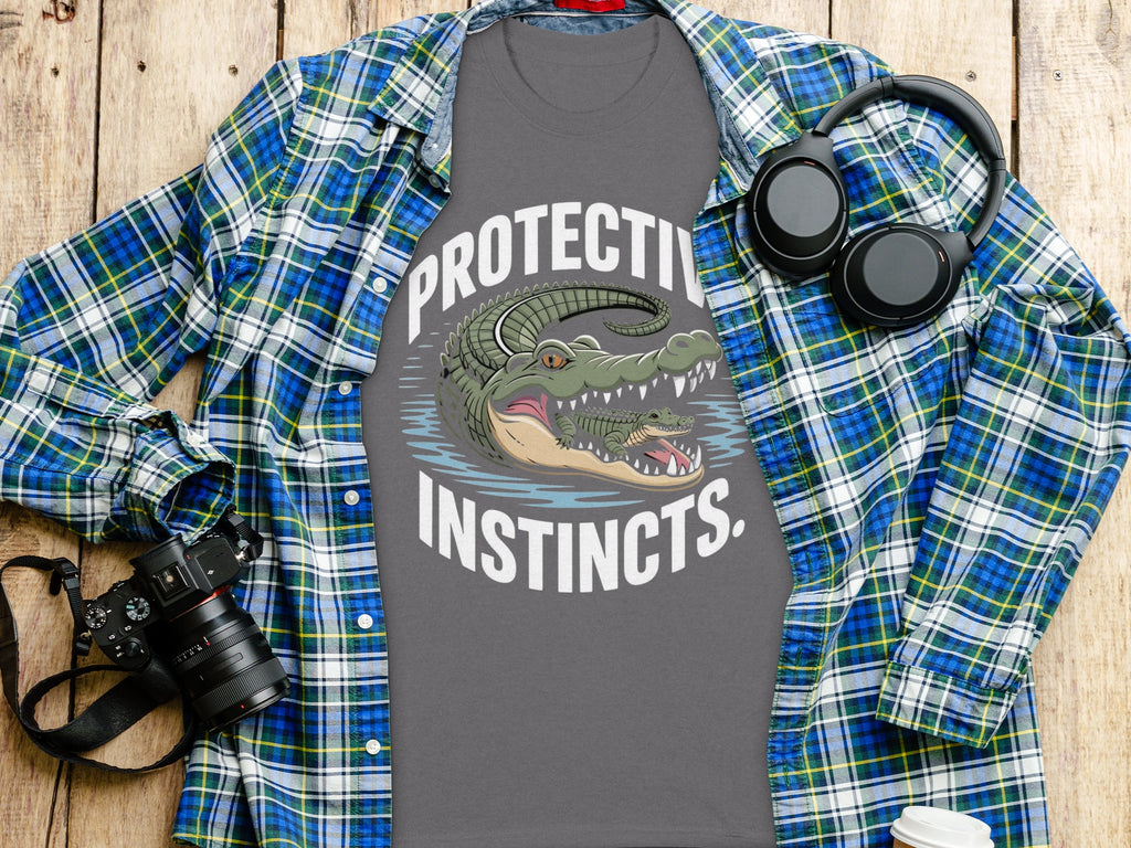 Grey t-shirt with two alligators and text "PROTECTIVE INSTINCTS".