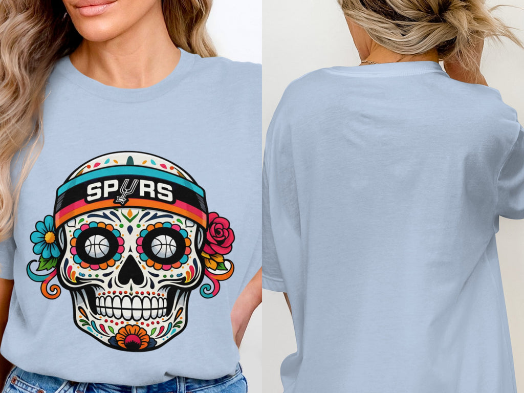 Light blue t-shirt with a colorful sugar skull design and "SPURS" text.
