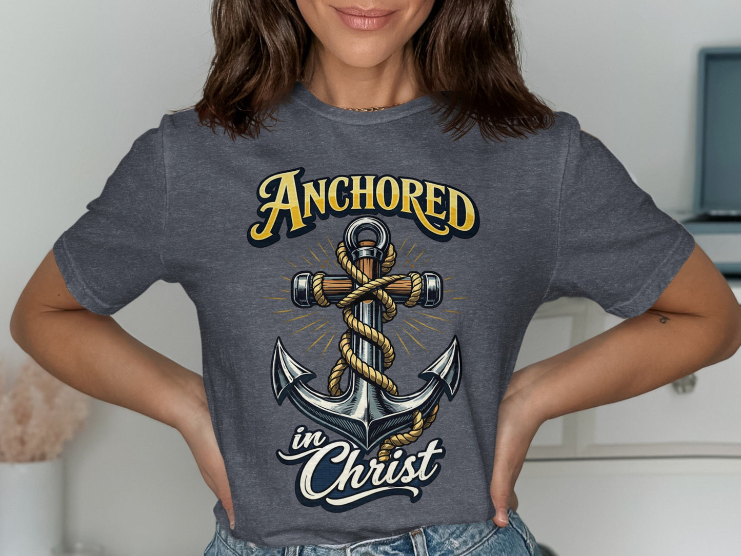 Anchor design with text "ANCHORED in Christ" on a grey t-shirt.