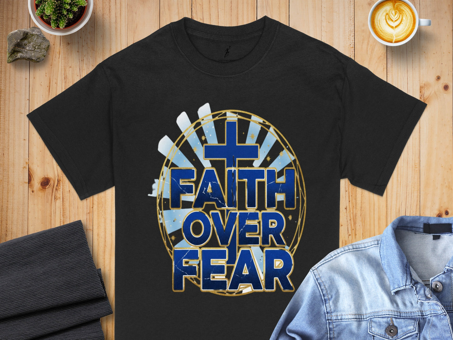 Black t-shirt with "Faith Over Fear" text and a blue cross graphic.