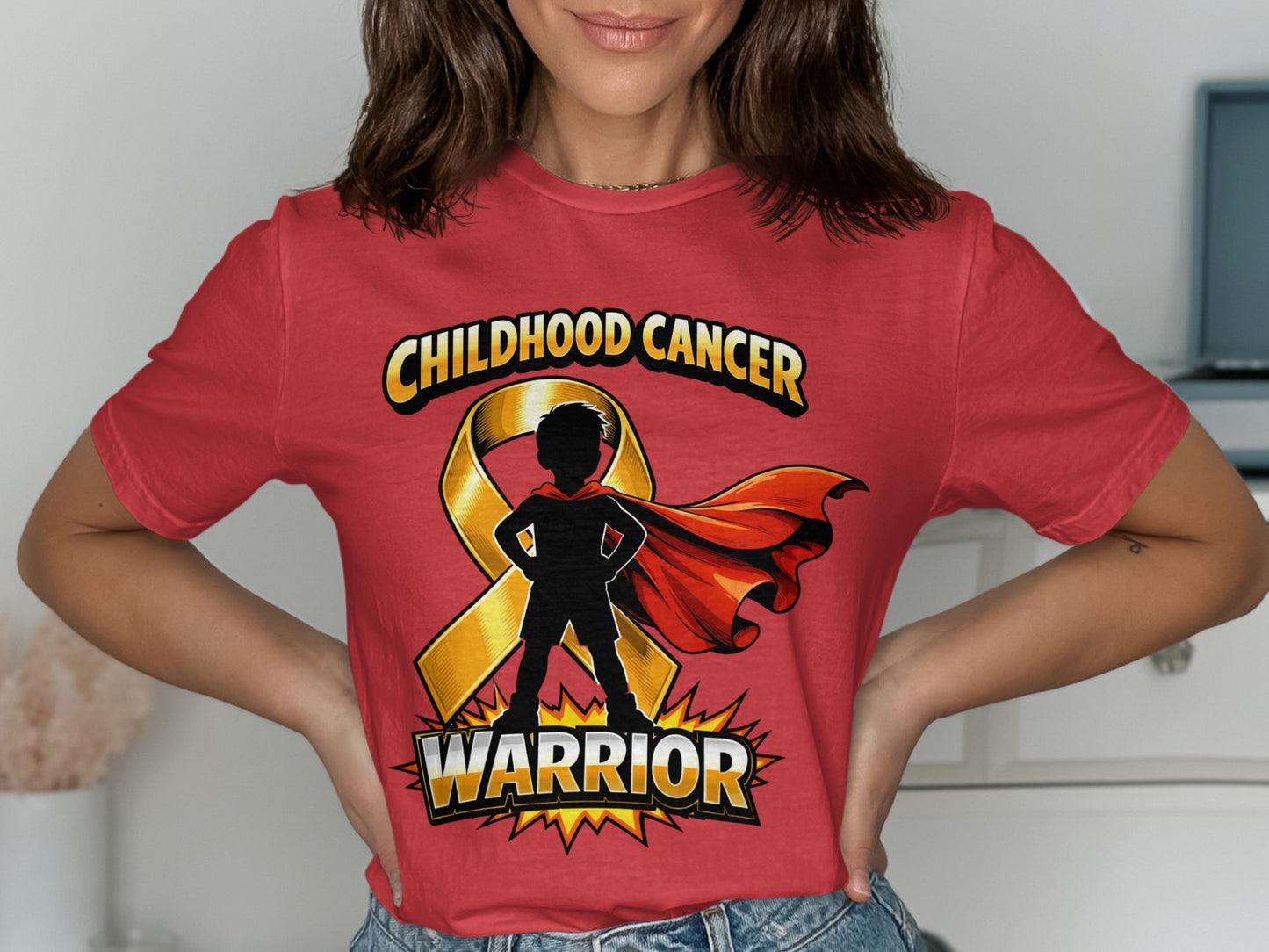 Red t-shirt with gold ribbon and silhouette of a superhero kid that says "WARRIOR."