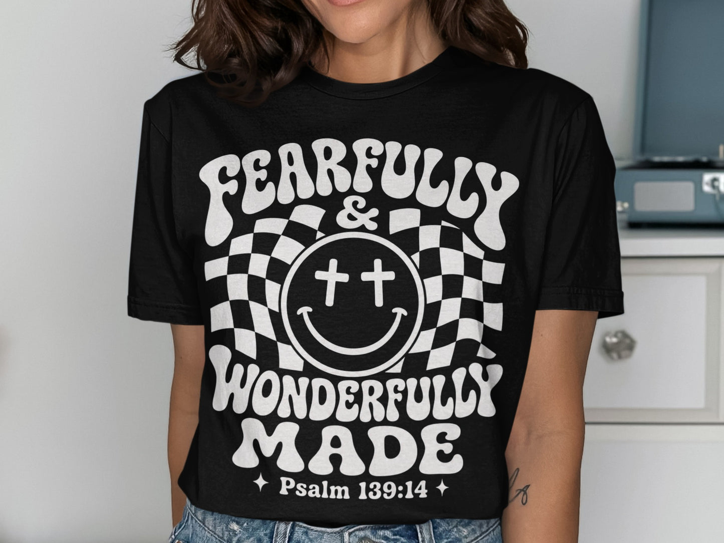 Black t-shirt with white text reading "FEARFULLY & WONDERFULLY MADE" and "Psalm 139:14".