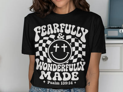 Black t-shirt with white text reading "FEARFULLY & WONDERFULLY MADE" and "Psalm 139:14".