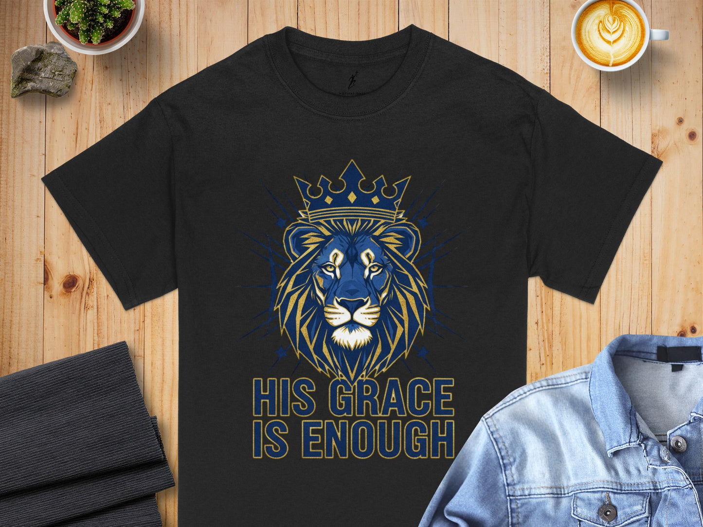 Black t-shirt with blue and gold lion wearing a crown, text "HIS GRACE IS ENOUGH".