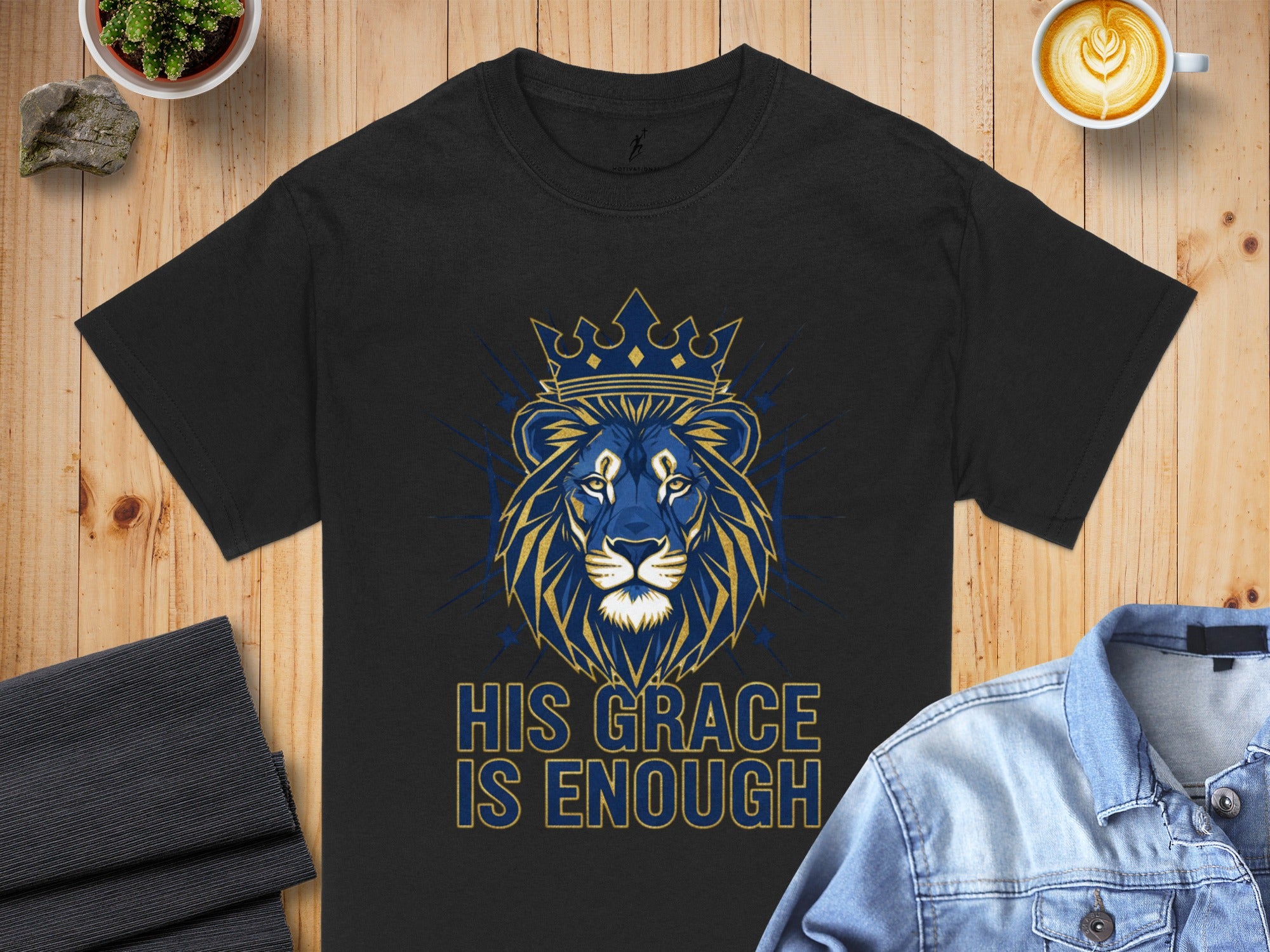 Black t-shirt with blue and gold lion wearing a crown, text "HIS GRACE IS ENOUGH".