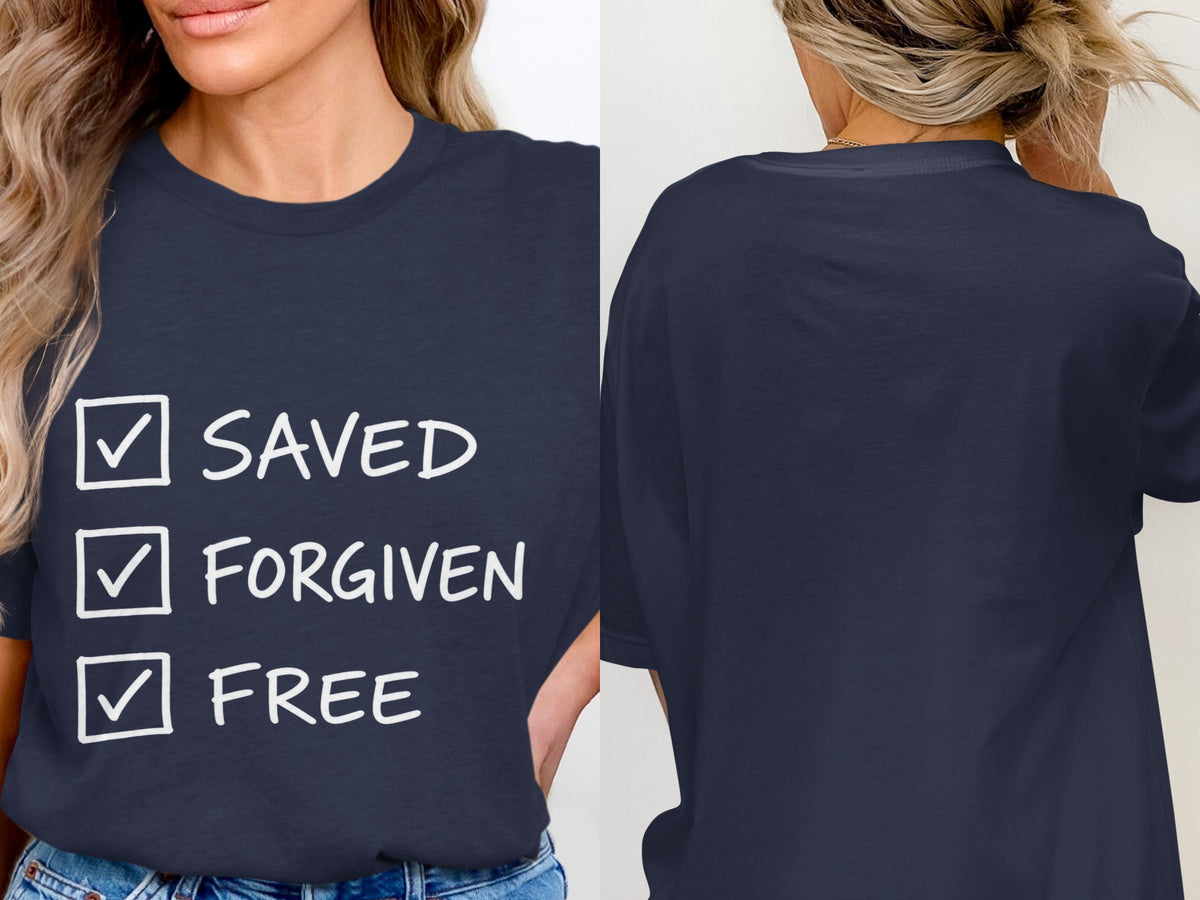 Navy t-shirt with white text "SAVED", "FORGIVEN", "FREE" and checked boxes.