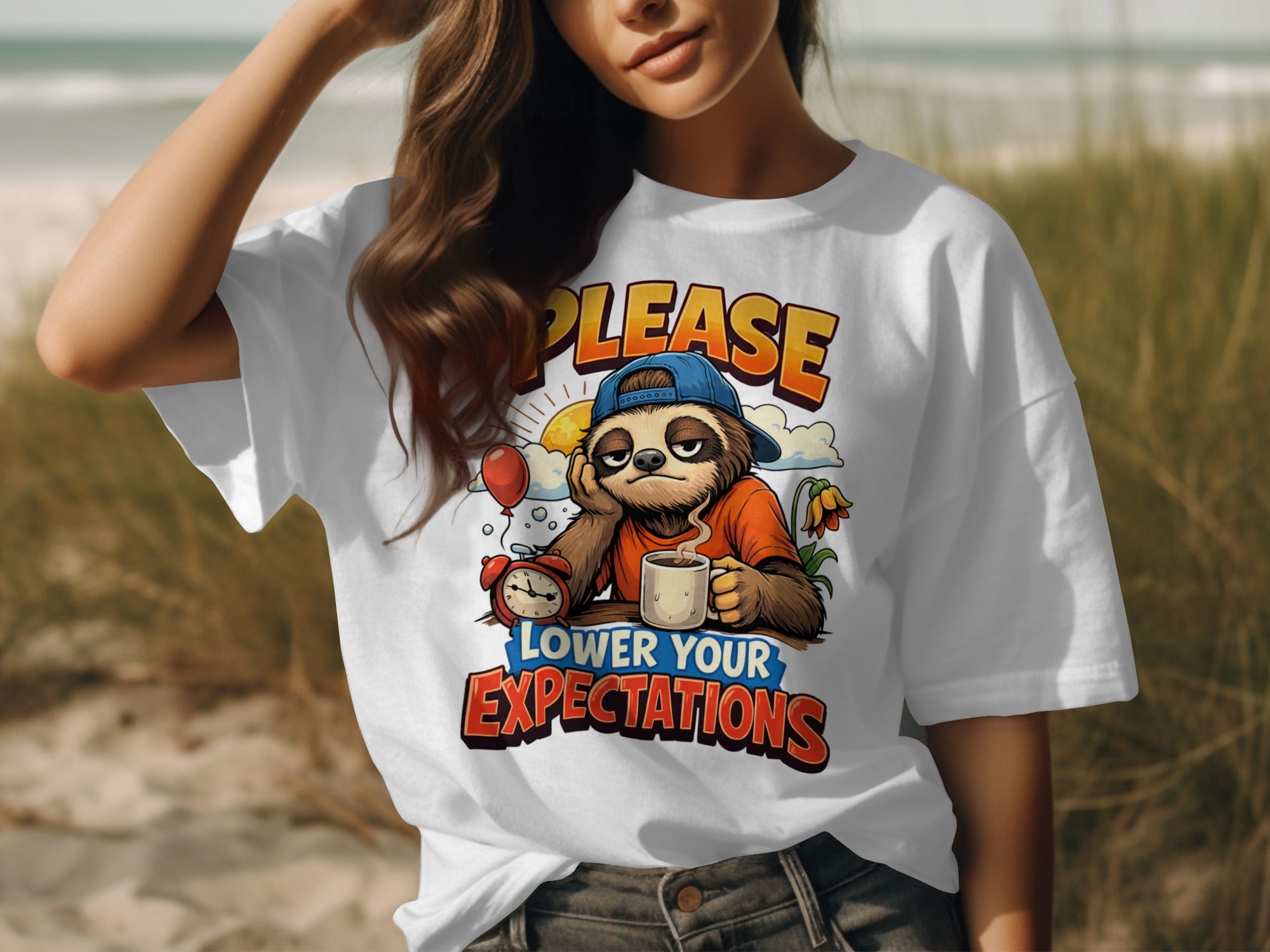 White t-shirt with a sloth graphic stating "PLEASE LOWER YOUR EXPECTATIONS".