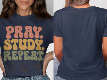 Dark blue t-shirt with "Pray. Study. Repeat." text and small icons.