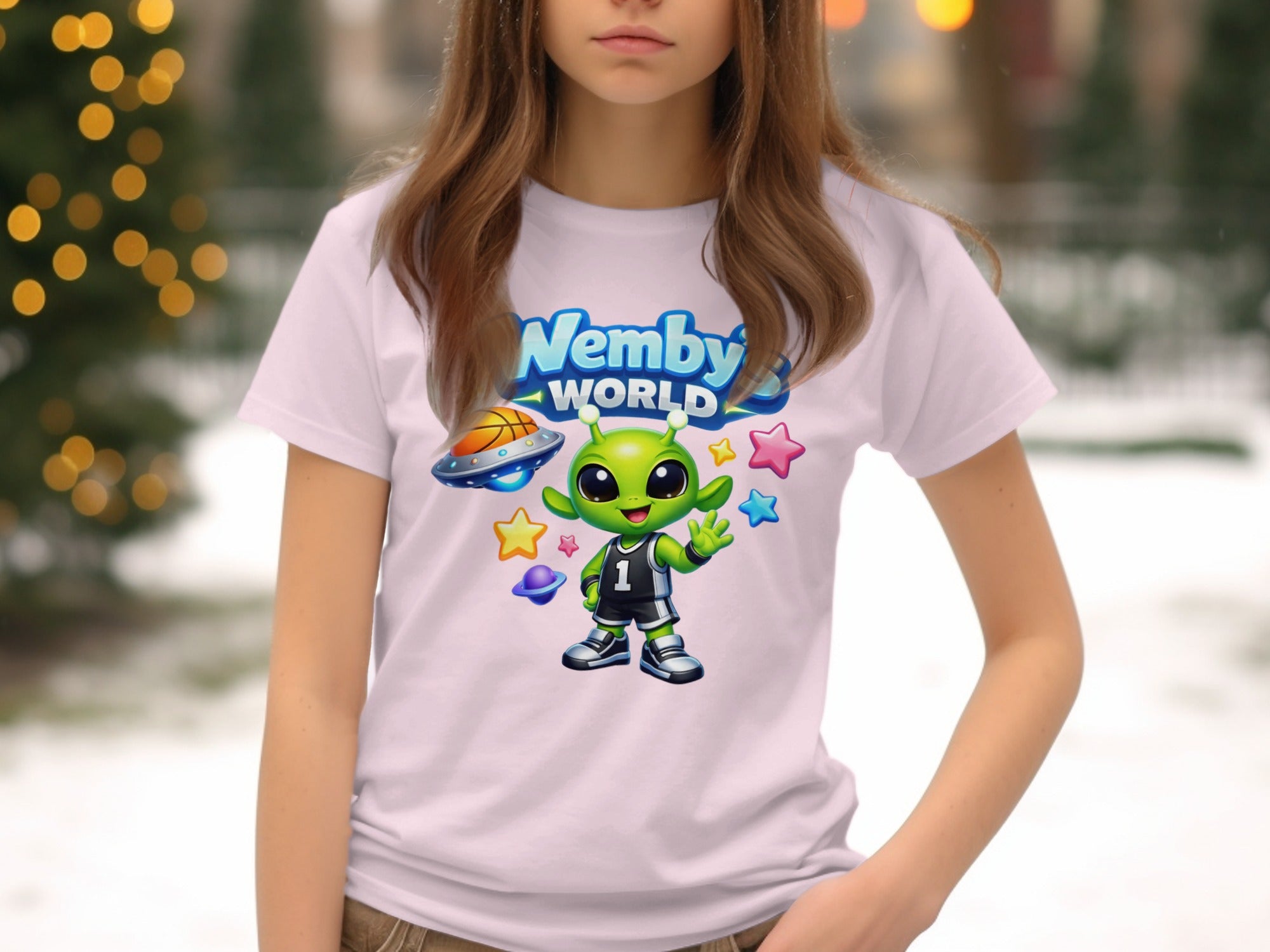 White t-shirt with "Nemby's WORLD" text over a cartoon alien in basketball gear.