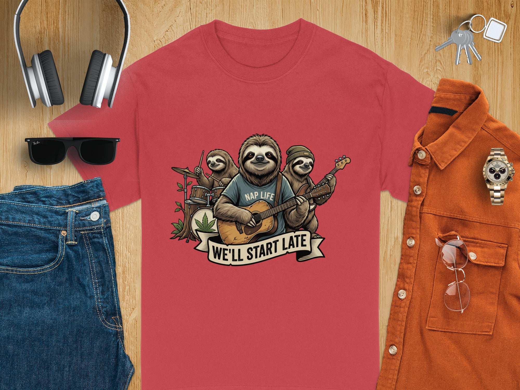 Red t-shirt with sloths playing instruments and text "NAP LIFE WE'LL START LATE".