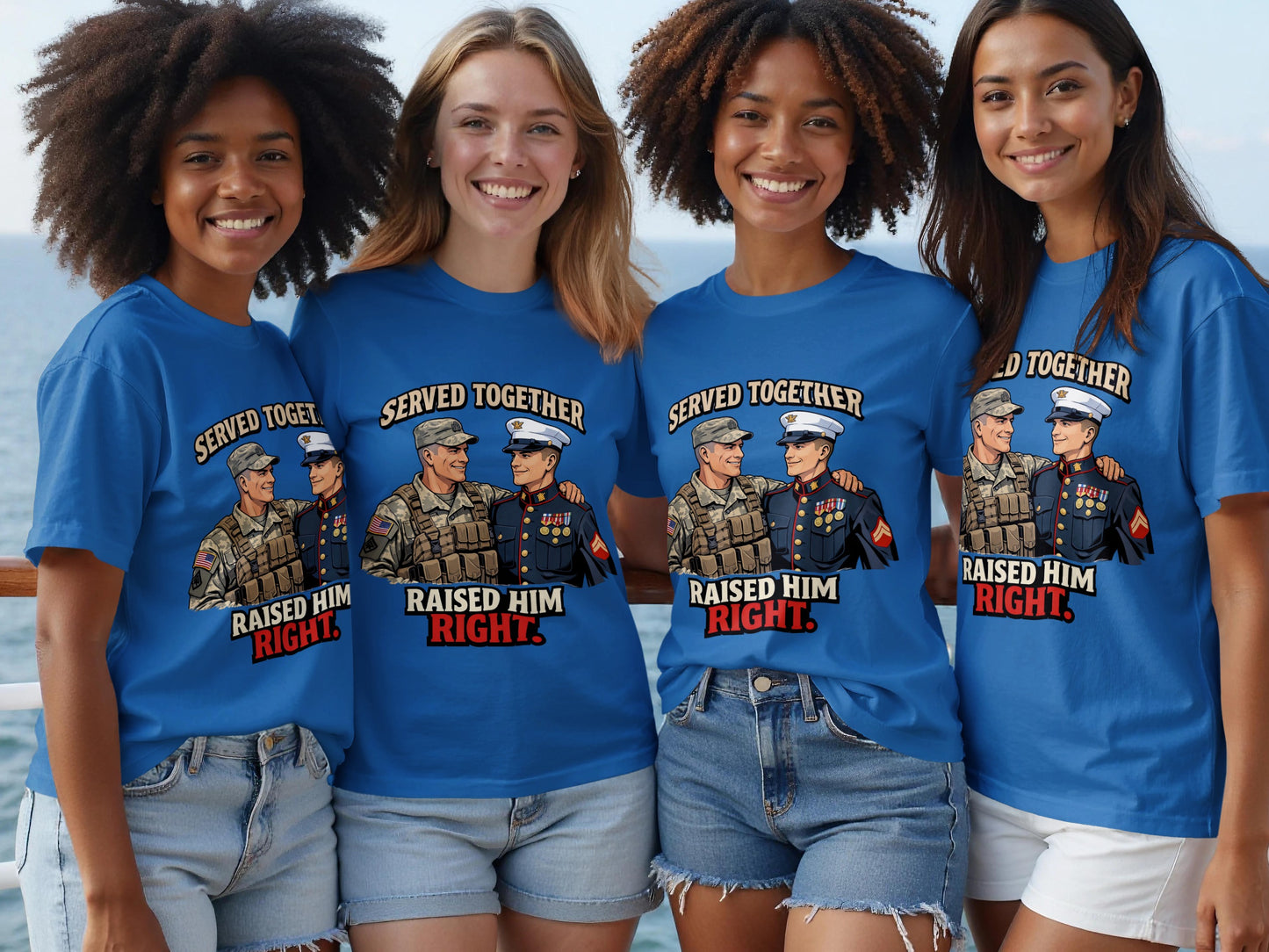Four women wear blue t-shirts with a graphic of two servicemen and text.