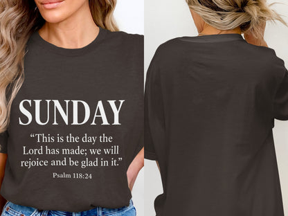Dark grey t-shirt with "SUNDAY" and Psalm 118:24 quote on front.