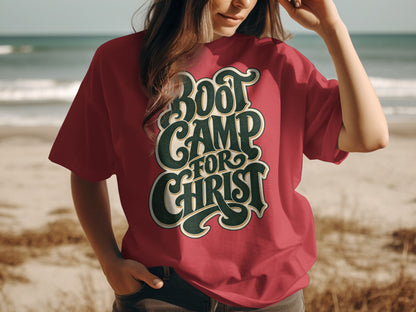 Red t-shirt with "Boot Camp For Christ" graphic on beach background.