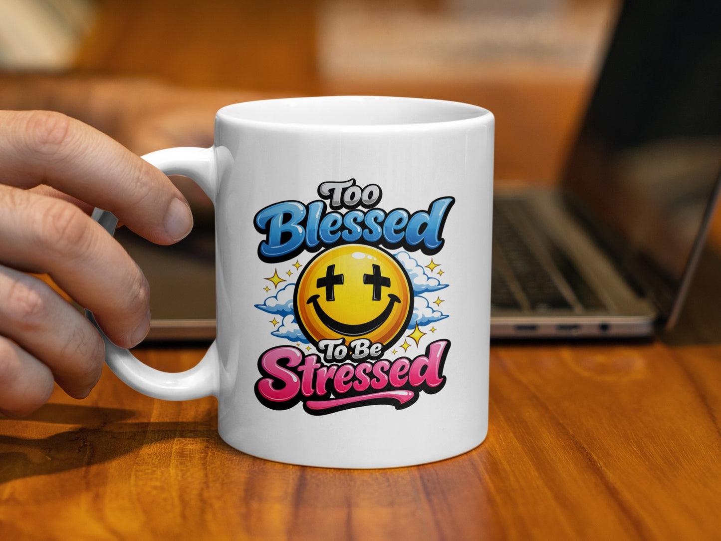 White mug with "Too Blessed To Be Stressed" text and smiley face illustration.