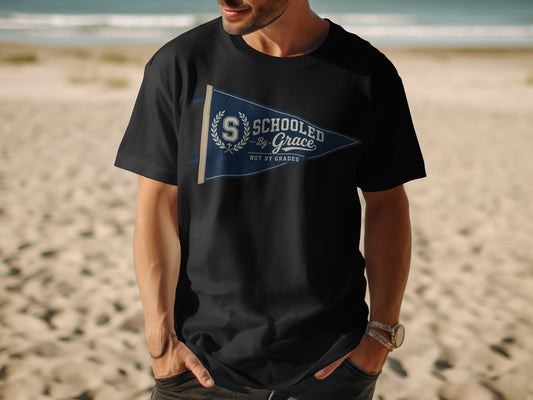 Black t-shirt with navy pennant graphic: "Schooled by Grace Not by Grades".