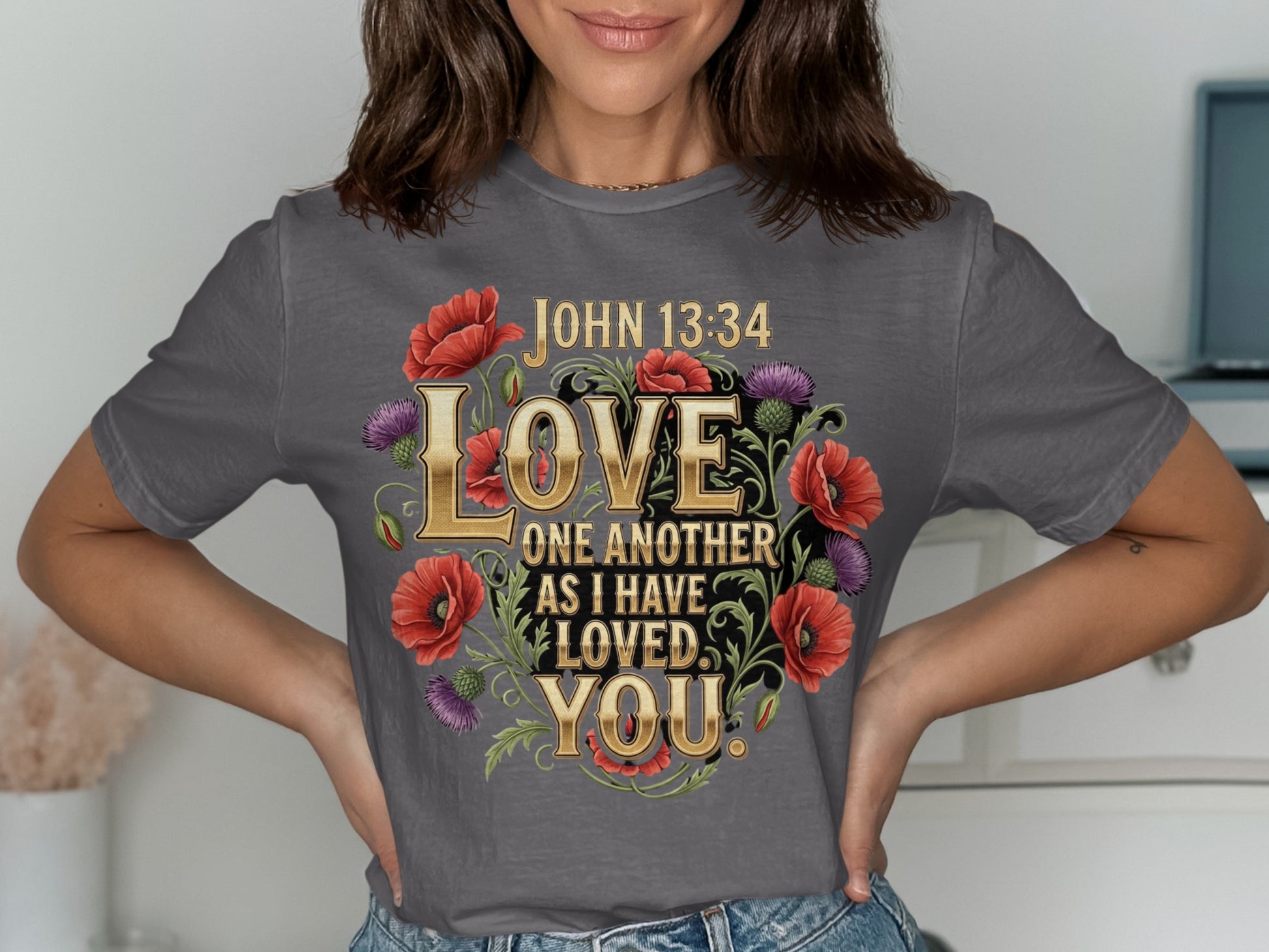 Gray t-shirt with "JOHN 13:34 LOVE ONE ANOTHER AS I HAVE LOVED YOU" and floral design.