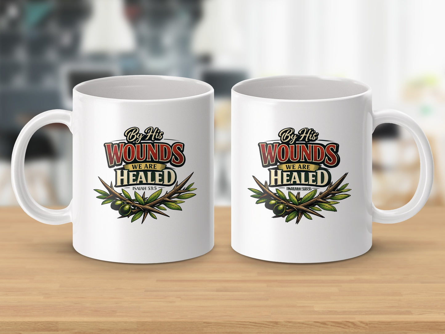 Two white mugs with "By His Wounds We Are Healed Isaiah 53:5" text and olive branches.