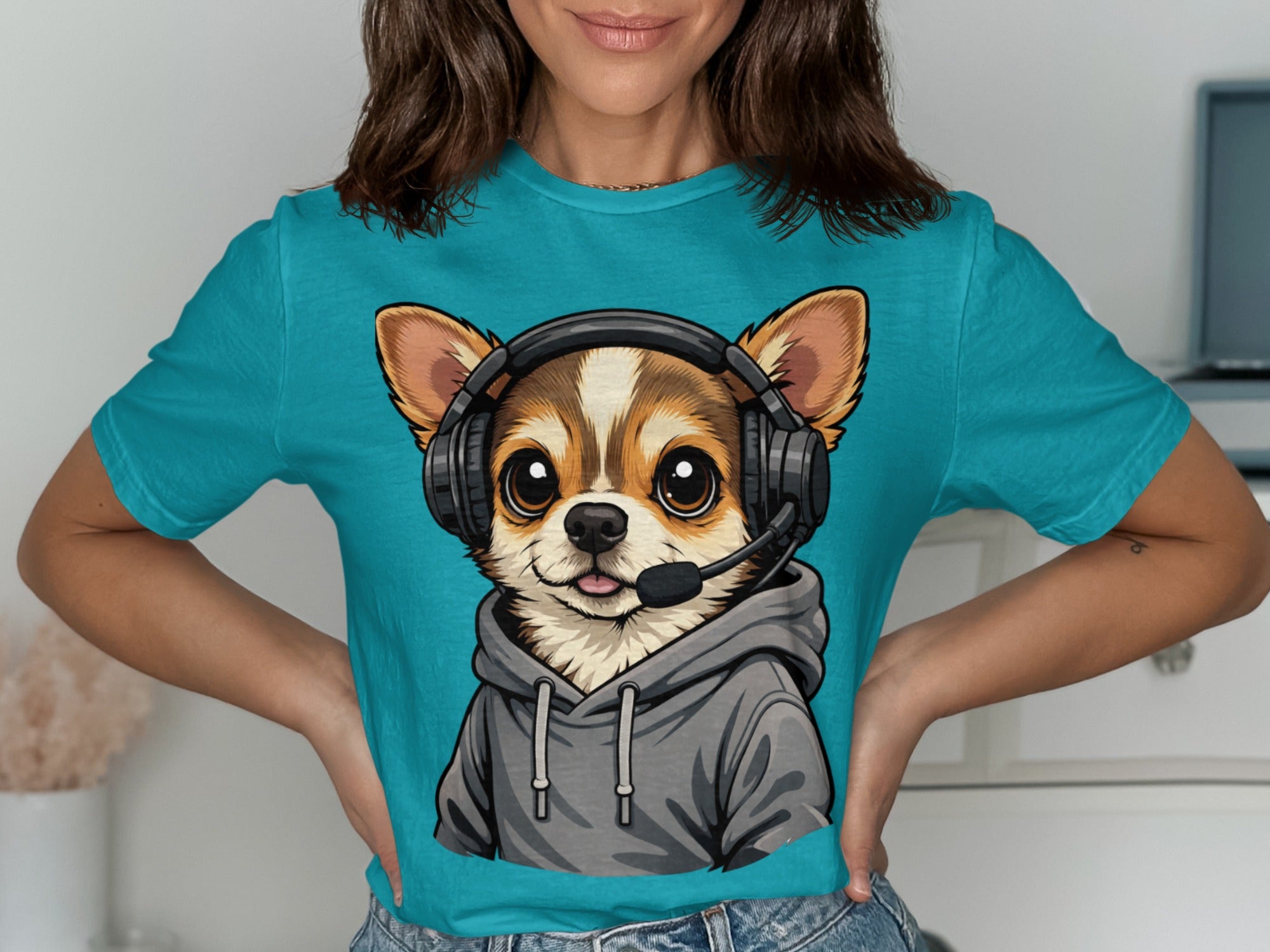 Chihuahua wearing headphones and a gray hoodie, printed on a teal t-shirt.
