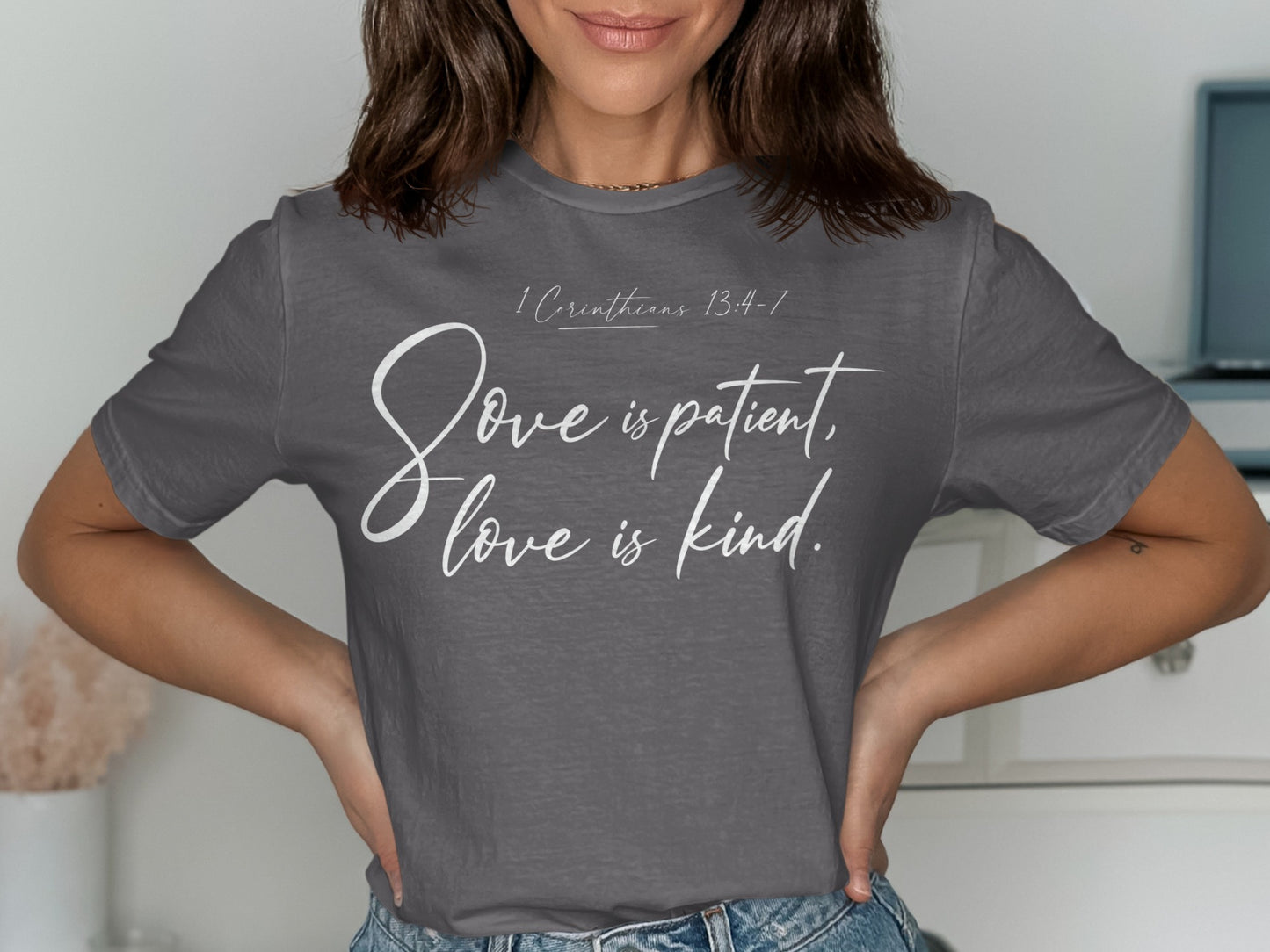 Grey t-shirt with white text: "1 Corinthians 13:4-7, Love is patient, love is kind."
