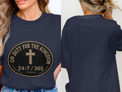 Navy t-shirt with a circular emblem featuring a cross and text "ON DUTY FOR THE KINGDOM 24:7 / 365".
