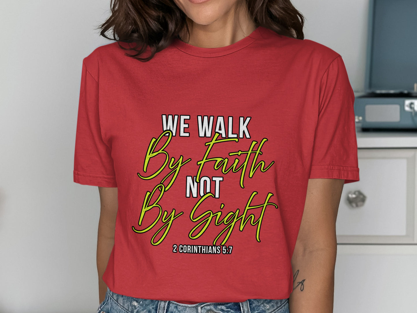 Red t-shirt with text "WE WALK By faith NOT By Sight 2 CORINTHIANS 5:7".
