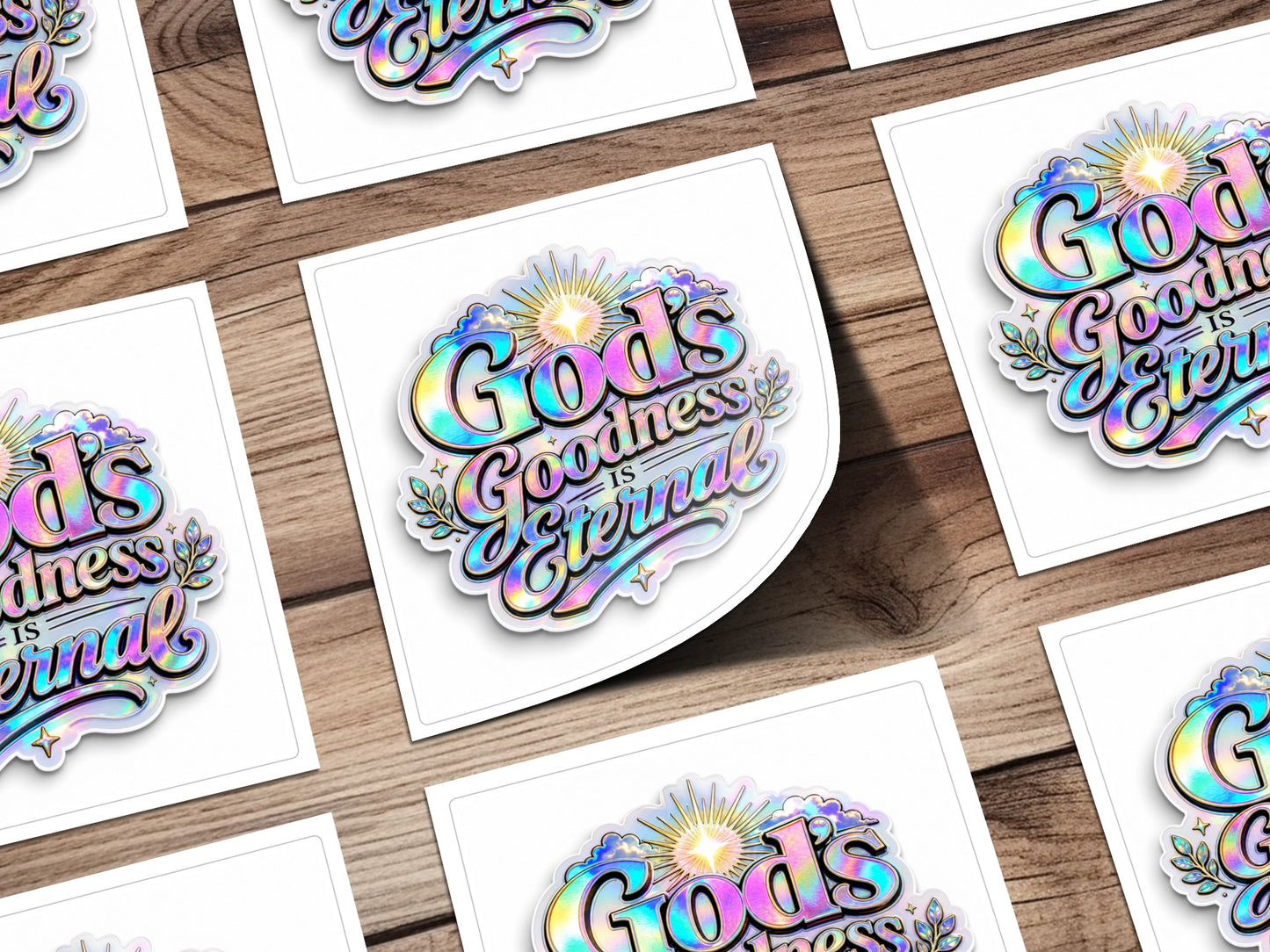 Holographic sticker with "God's Goodness Is Eternal" text and sunburst.
