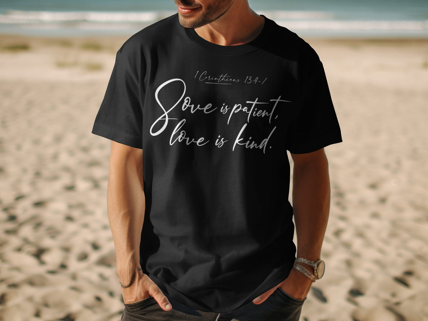 Black t-shirt with white text: "1 Corinthians 13:4-7 Love is patient, love is kind."
