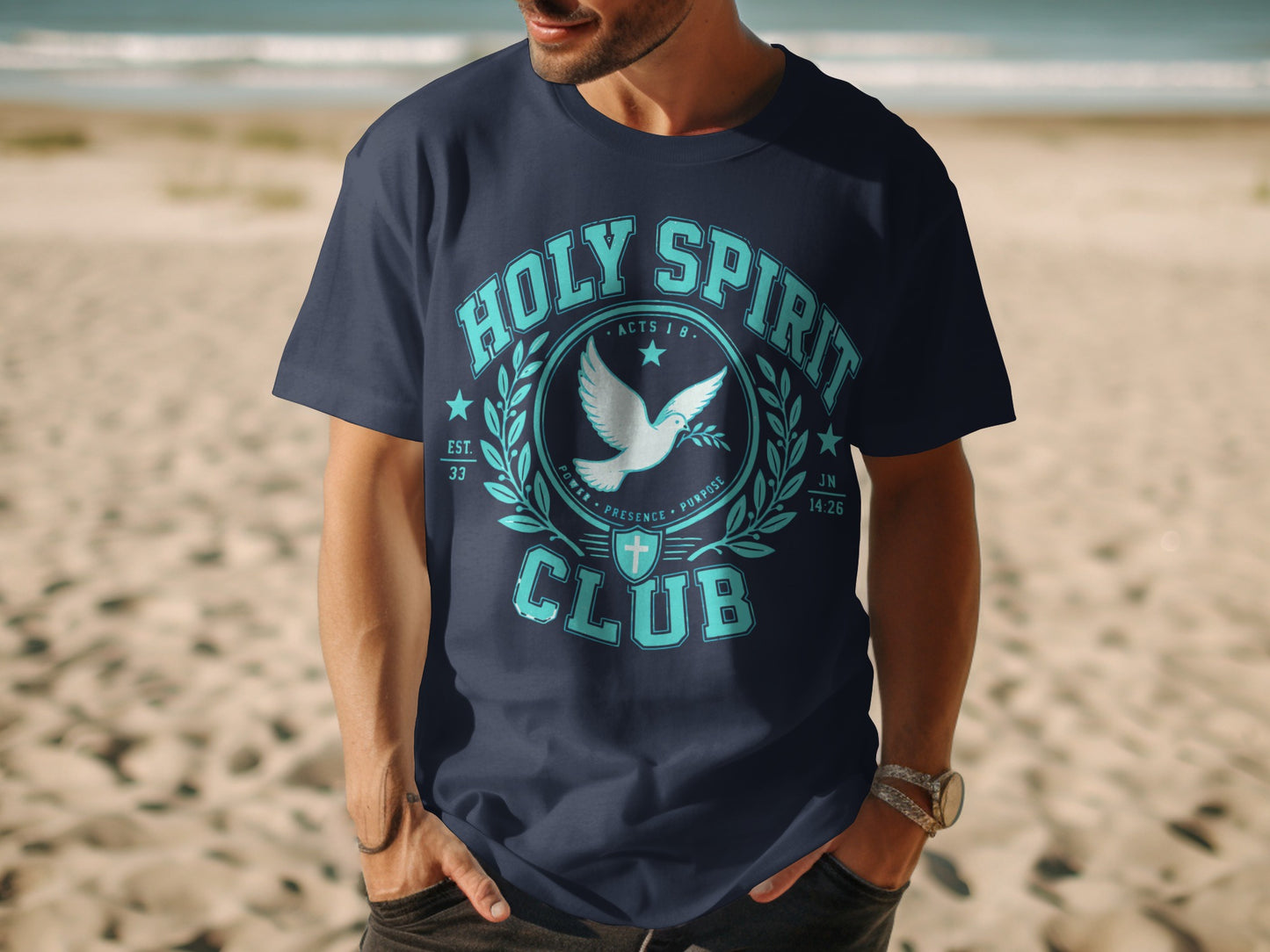 Men's navy t-shirt featuring "HOLY SPIRIT CLUB" with dove and laurel wreath graphic.