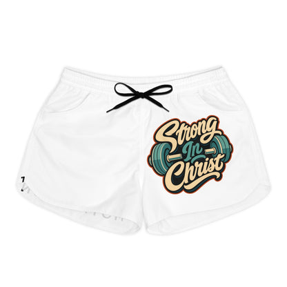 White shorts with "Strong In Christ" text and a dumbbell graphic.