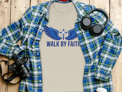 Tan t-shirt with "WALK BY FAITH" and blue wings with cross graphic.