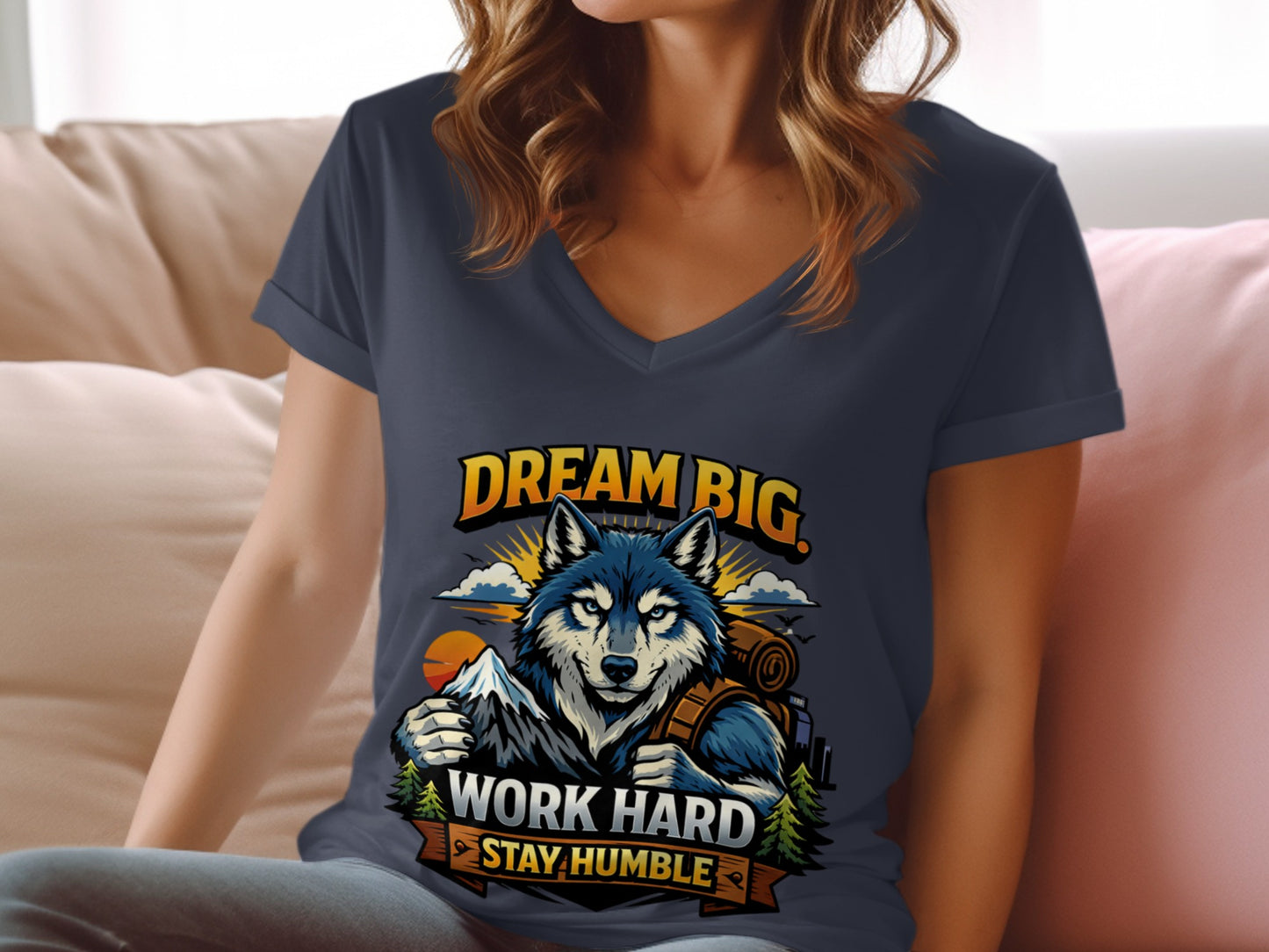 Wolf with backpack and mountains graphic on t-shirt, "DREAM BIG WORK HARD STAY HUMBLE".
