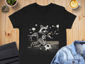 Black t-shirt with a raccoon playing soccer graphic and the number 07.