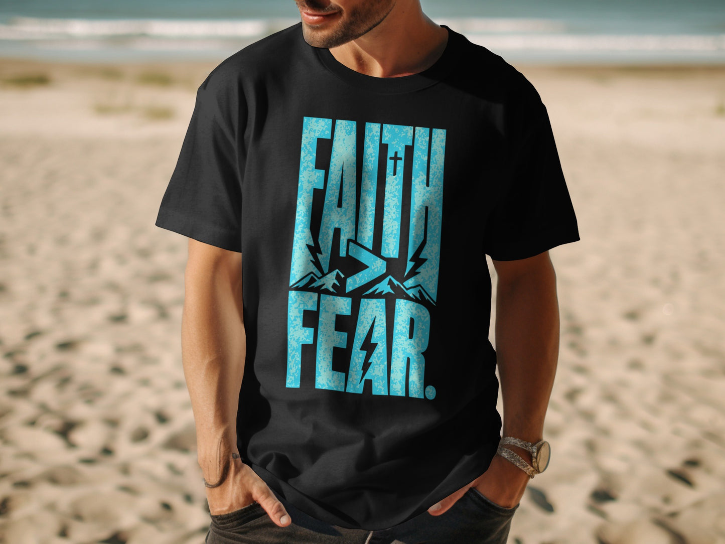 Black t-shirt with blue text "FAITH > FEAR" featuring mountains.