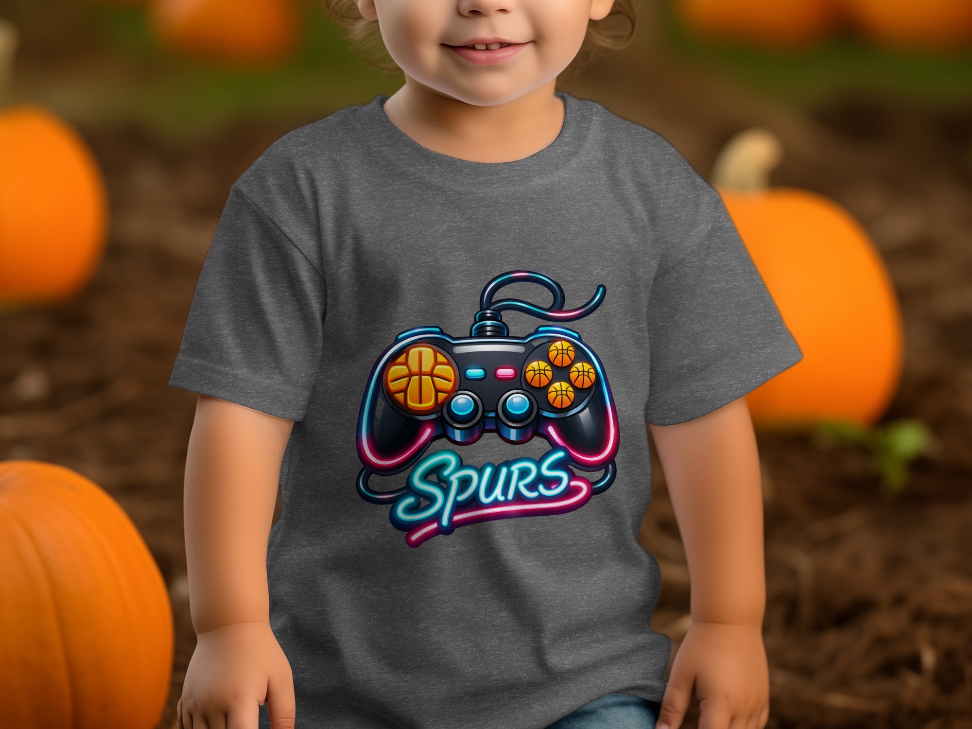 Gray t-shirt on child with a neon video game controller and "Spurs" text.