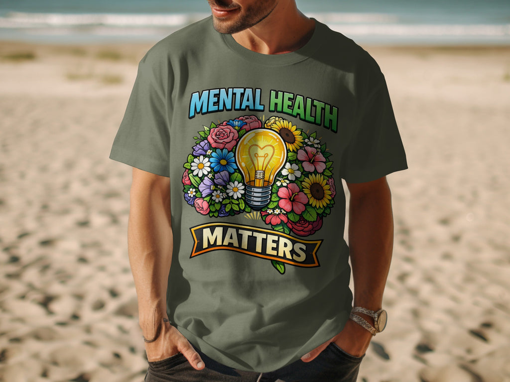 Green t-shirt with "Mental Health Matters" text and lightbulb surrounded by flowers.