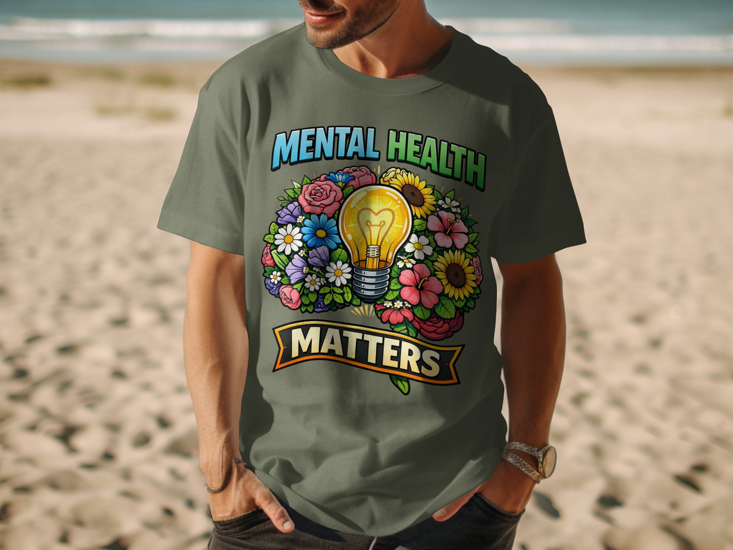 Green t-shirt with "Mental Health Matters" text and lightbulb surrounded by flowers.