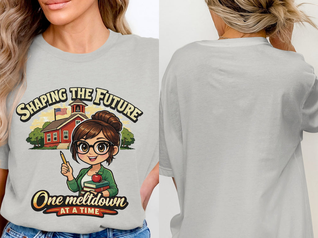 Light gray t-shirt with cartoon of teacher holding pencil, books, and apple with text "Shaping the Future One Meltdown At A Time."