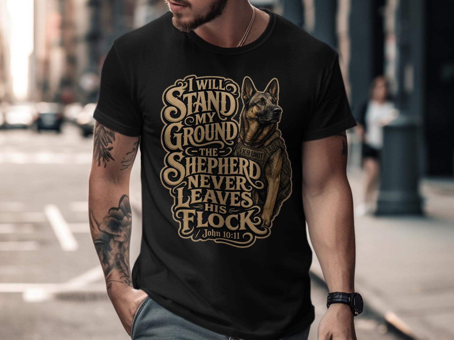 Black t-shirt with a German Shepherd graphic and the text "I will stand my ground the shepherd never leaves his flock John 10:11".